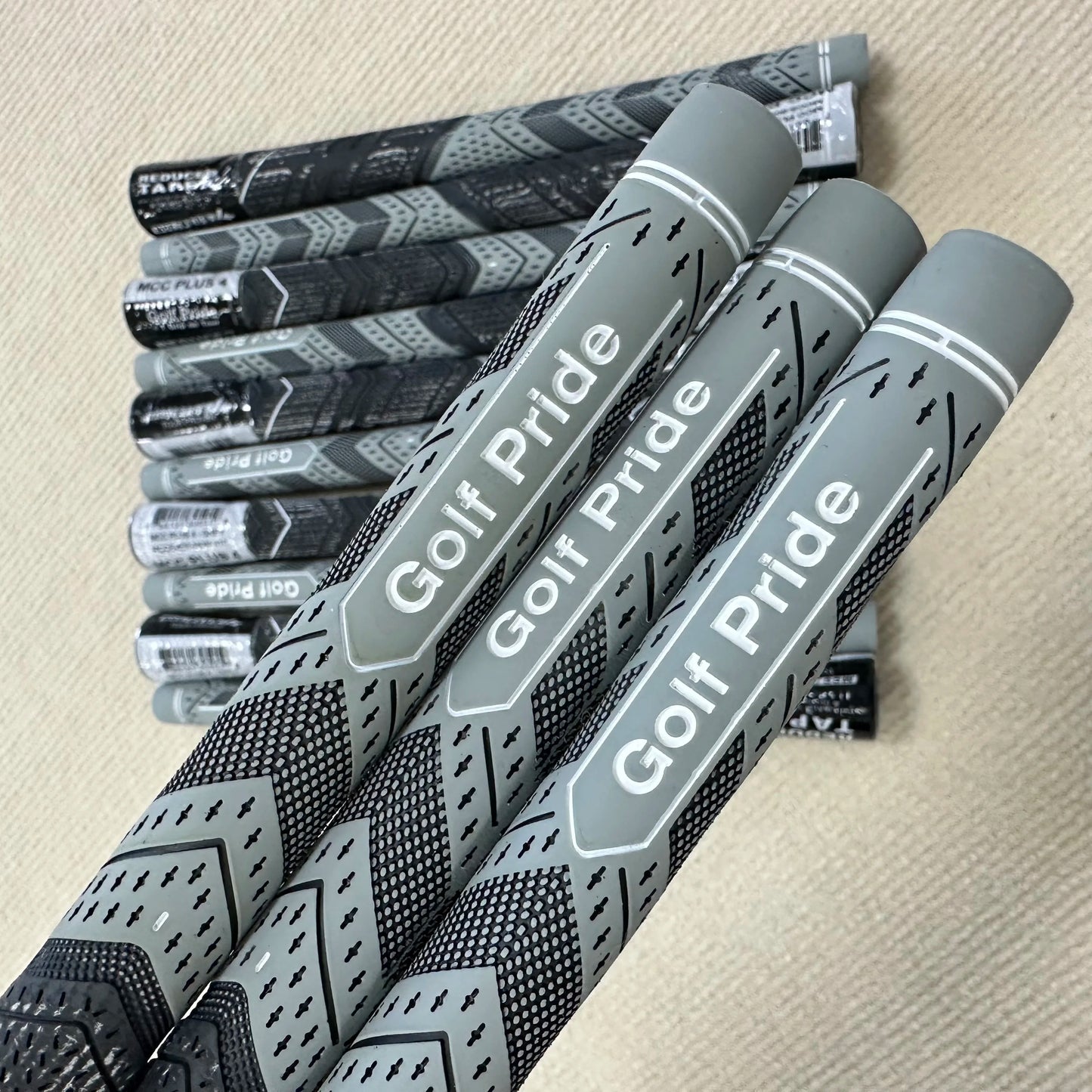 13 pieces of grey Golf Pride MCC PLUS4