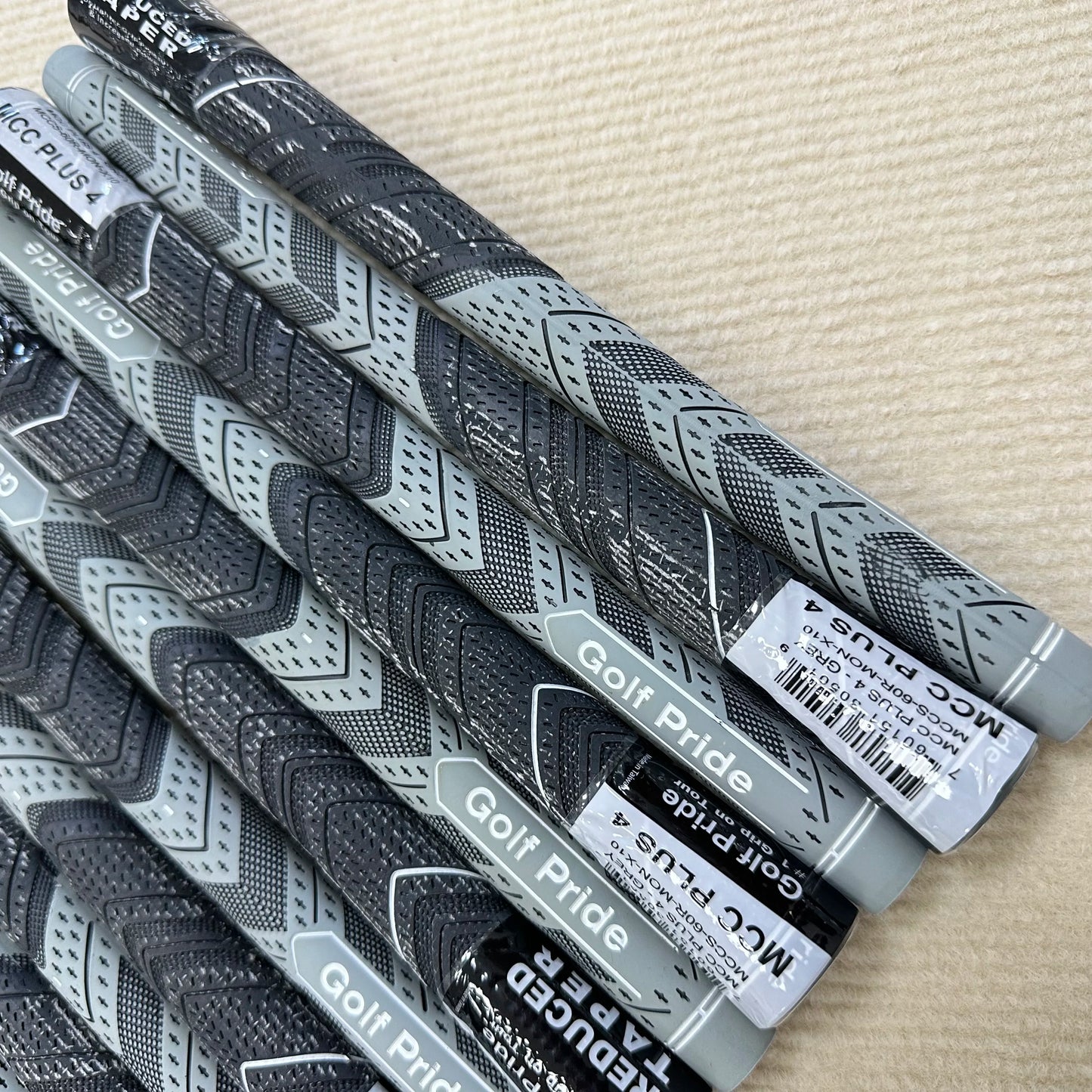 13 pieces of grey Golf Pride MCC PLUS4
