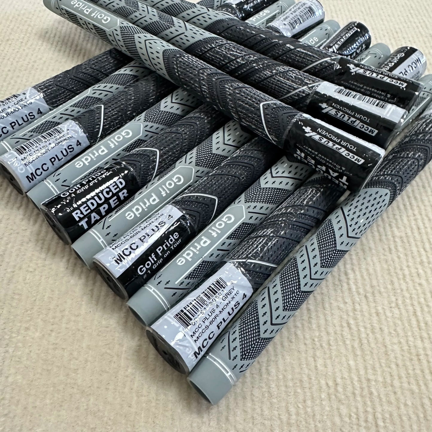 13 pieces of grey Golf Pride MCC PLUS4
